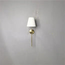 Modern brass led wall sconce with white fabric shade for bedroom