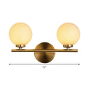 Modern brass light fixture with glass product shade – bedroom sconce