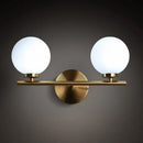 Modern brass light fixture with glass product shade – bedroom sconce