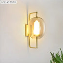 Modern brass oval clear glass shade wall sconce bedroom light