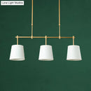 Modern brass pendant light with white green flaxen shades dining room