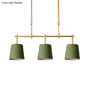 Modern brass pendant light with white green flaxen shades dining room