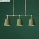 Modern brass pendant light with white green flaxen shades dining room