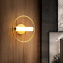Modern brass ring wall sconce with opal glass shade bedroom light