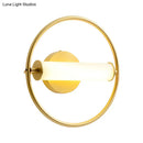Modern brass ring wall sconce with opal glass shade bedroom light