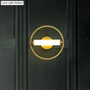 Modern brass ring wall sconce with opal glass shade bedroom light