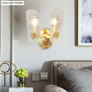 Modern brass sconce with clear water glass for living room two lights