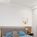 Modern brass sconce with clear water glass for living room two lights
