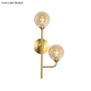 Modern brass sphere wall sconce amber & smoke gray bathroom light
