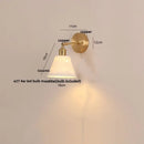 Modern brass wall lamp with frosted glass shade for bedroom reading