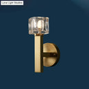 Modern brass wall light with clear crystal block for living room