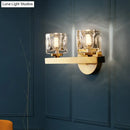 Modern brass wall light with clear crystal block for living room