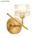 Modern brass wall light with clear crystal shade – bedroom sconce