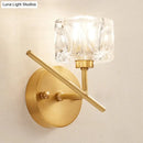 Modern brass wall light with clear crystal shade – bedroom sconce