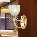 Modern brass wall sconce bedroom light with faceted clear glass shade