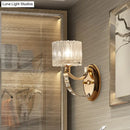 Modern brass wall sconce bedroom light with faceted clear glass shade