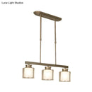 Modern brushed nickel pendant light with clear glass shade dining room