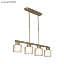 Modern brushed nickel pendant light with clear glass shade dining room