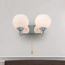Modern chrome and cream glass wall light bedroom sconce with pull chain