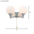 Modern chrome and cream glass wall light bedroom sconce with pull chain