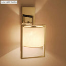 Modern chrome cylinder sconce light – bedroom fabric light fixture