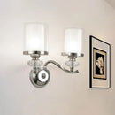 Modern chrome dual cylinder bathroom sconce with curvy arm