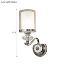 Modern chrome dual cylinder bathroom sconce with curvy arm