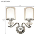 Modern chrome dual cylinder bathroom sconce with curvy arm