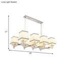 Modern chrome island pendant light with cream shades for dining rooms