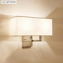 Modern chrome led wall sconce with white fabric shade bedroom light