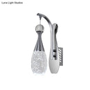 Modern chrome teardrop led sconce – bedroom seeded crystal wall light