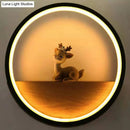 Modern circular black wall light with decorative deer living room