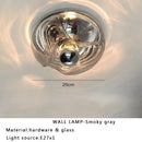 Modern circular swirling designer glass wall lamp for bedroom