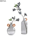 Modern clear glass vase with orange handles living room decor