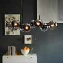 DecorBites™ Clear/Smoke Glass 8 Bulbs Suspended Lighting Fixture in Black/Gold for Dining Room