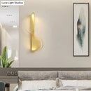 Modern curved gold wall sconce warm white light bedroom fixture