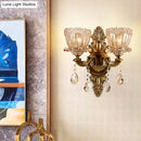 Modern floral brass wall sconce with teardrop crystal drop living room