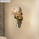 Modern floral brass wall sconce with teardrop crystal drop living room