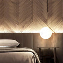 Modern frosted glass ball pendant light with gold ring for bedroom