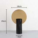 Modern geometric cylinder vase with pink artificial flowers living room