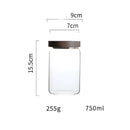 Modern glass hermetic storage jars with dark wood airtight lids kitchen