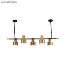 Modern gold and black drum pendant light for dining room island