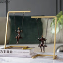 Modern gold and bronze swing metal sculpture living room decor