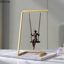 Modern gold and bronze swing metal sculpture living room decor