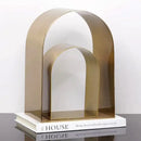 Modern gold & black golden arches metal sculpture living room bookend