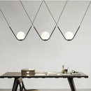 Modern gold & black pendant light dining room spherical glass trio