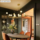 Modern gold branch pendant light with birds for dining room