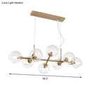 Modern gold chandelier with clear glass globes for dining room