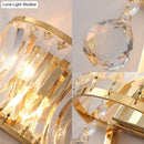 Modern gold curved wall light with clear crystal prism bedroom