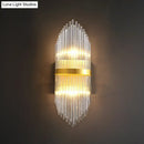Modern gold flute shaped wall sconce with clear crystal rods bedroom